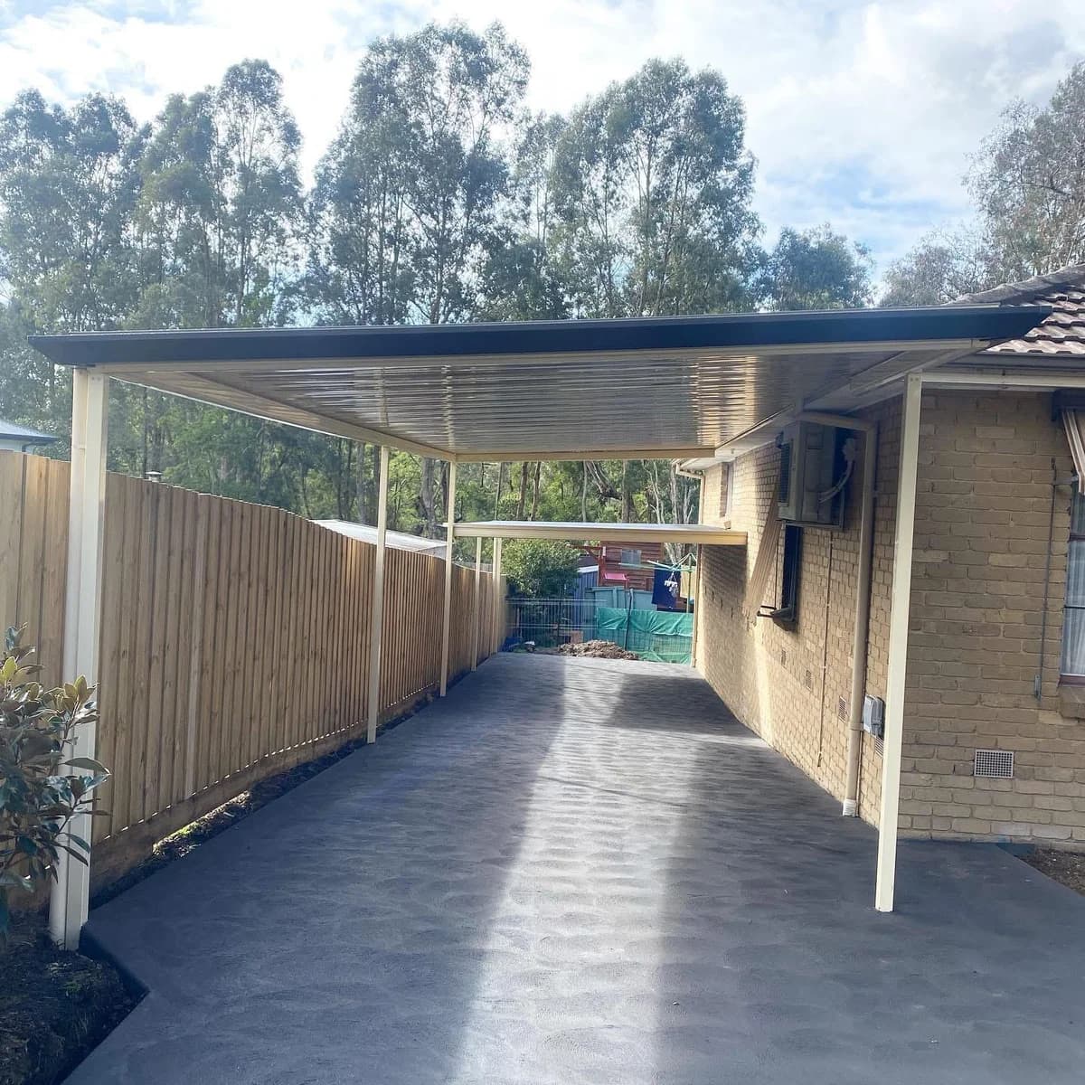 Extended flat roof carport for multiple vehicles Hawthorn