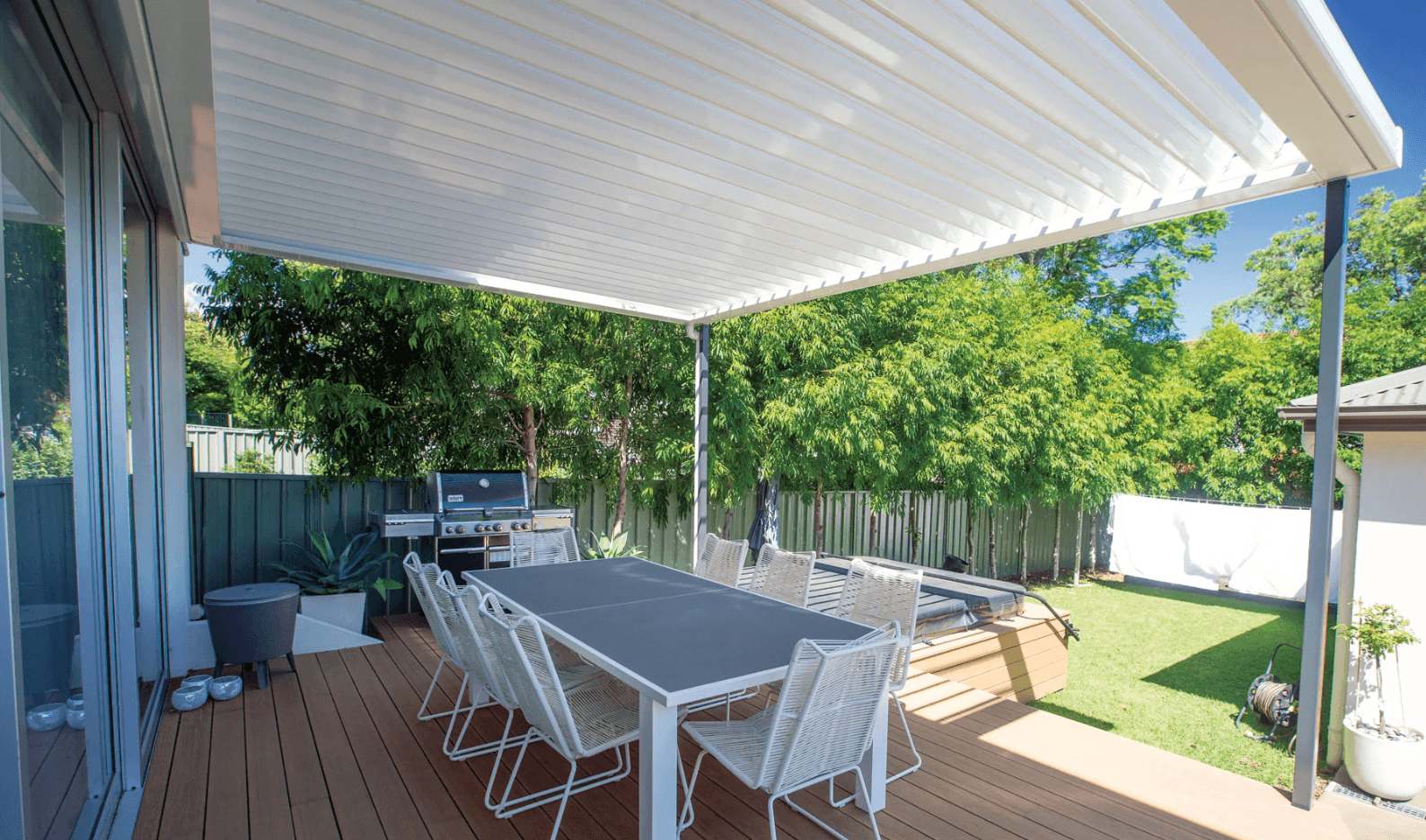 Backyard louvred pergola with outdoor dining Kew