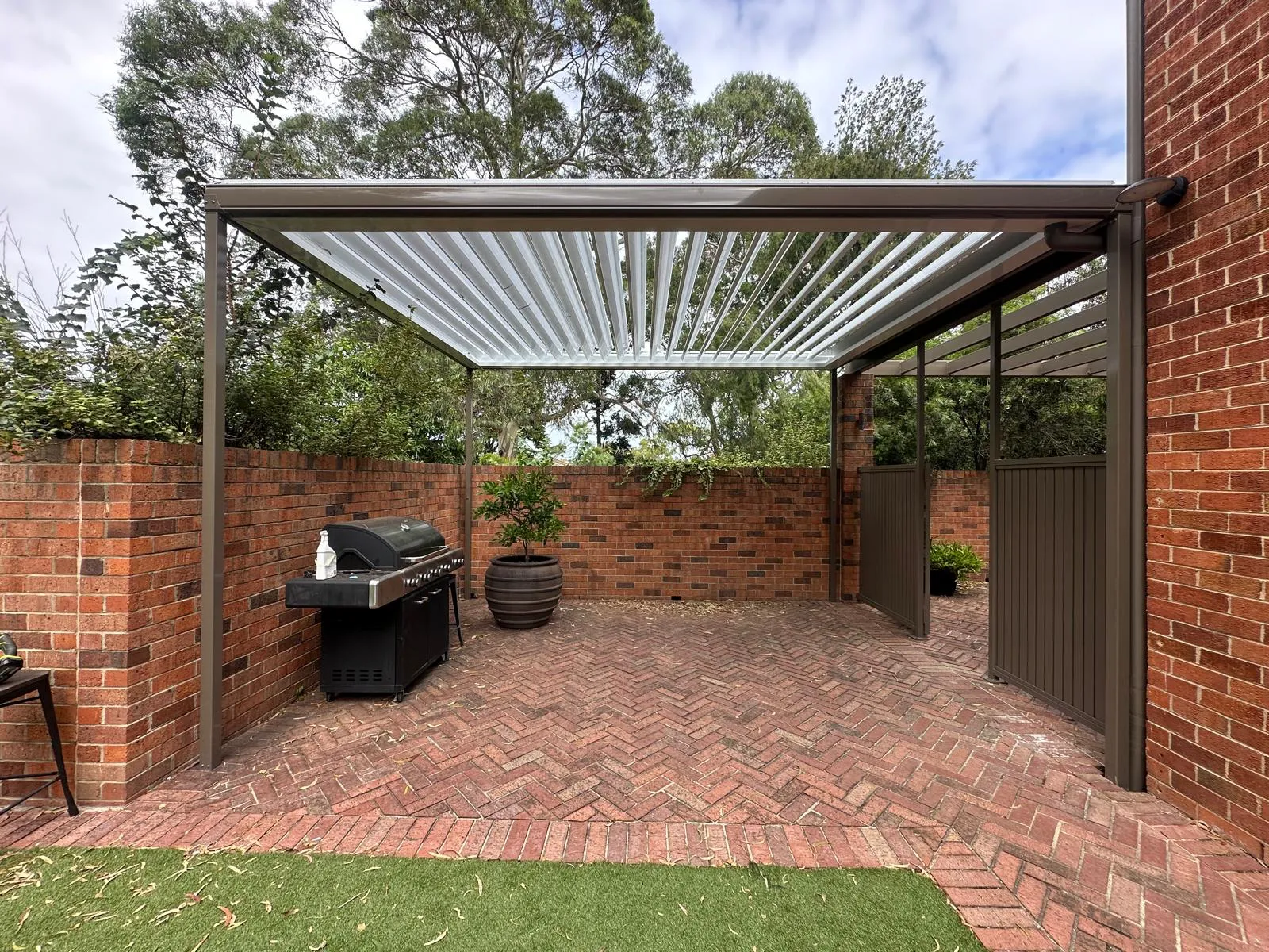 Freestanding louvre pergola with BBQ area