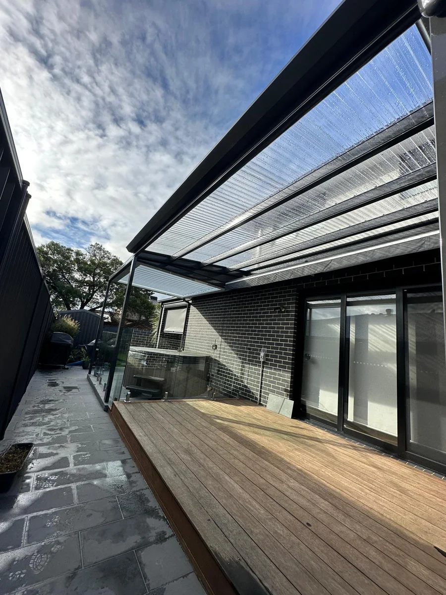 Pergola with polycarbonate roof over timber deck